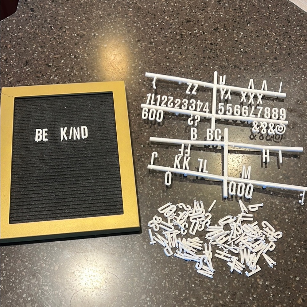 Gold and Black Letter Board with White Letters